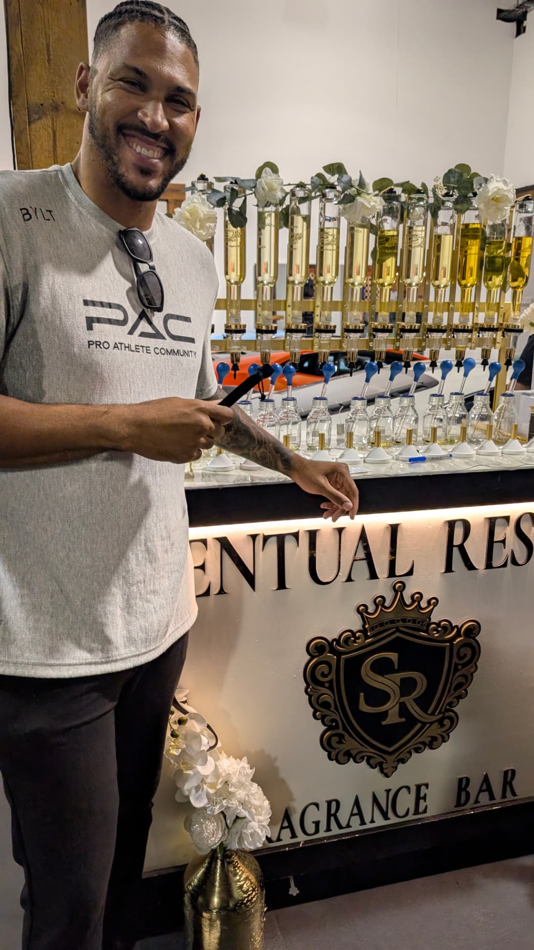 A guest holding his finished fragrance at the automotive-event bar