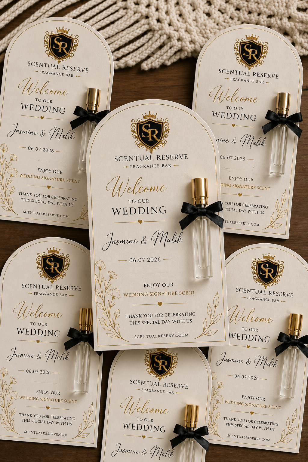 Jasmine and Malik wedding welcome cards with black-bow fragrance vials