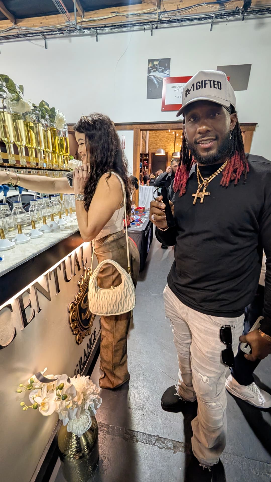 Guests creating fragrances at the Scentual Reserve bar during an automotive event